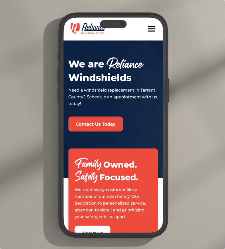 Reliance Windshields website design on phone, auto repair business homepage