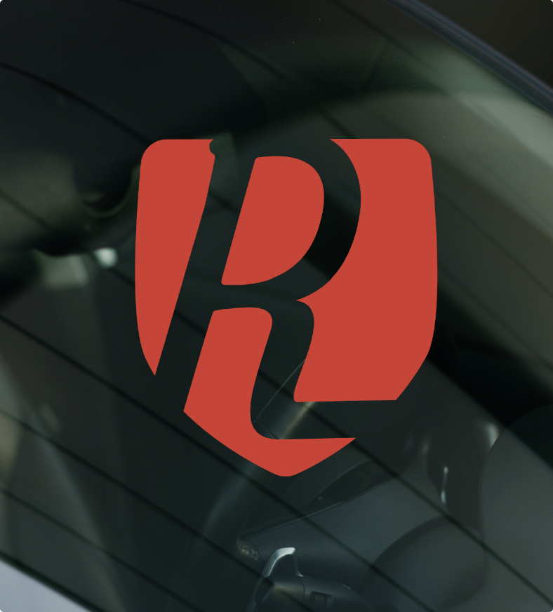 Reliance Windshields branding, letter R in a shield logo